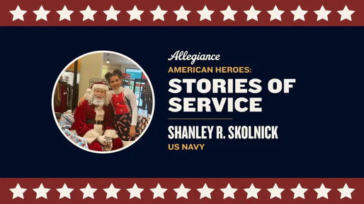 Shanley R. Skolnick poses with a person dressed as Santa Claus in a festive store setting.