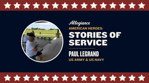 Paul Legrand, a veteran of the US Army and US Navy, seated under a pavilion, with American flags displayed in the background