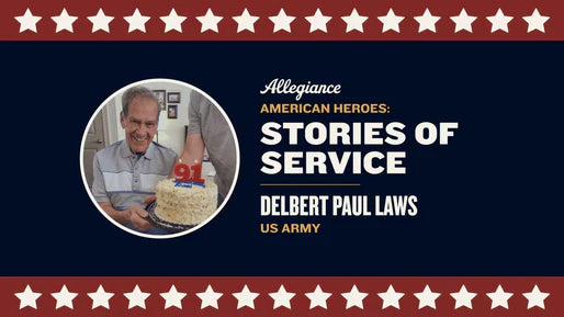 Delbert Paul Laws, US Army veteran, smiling while holding a cake with a "91" candle for his birthday celebration