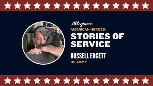 Russell Edgett, US Army veteran, embracing a large dog affectionately in a cozy indoor setting