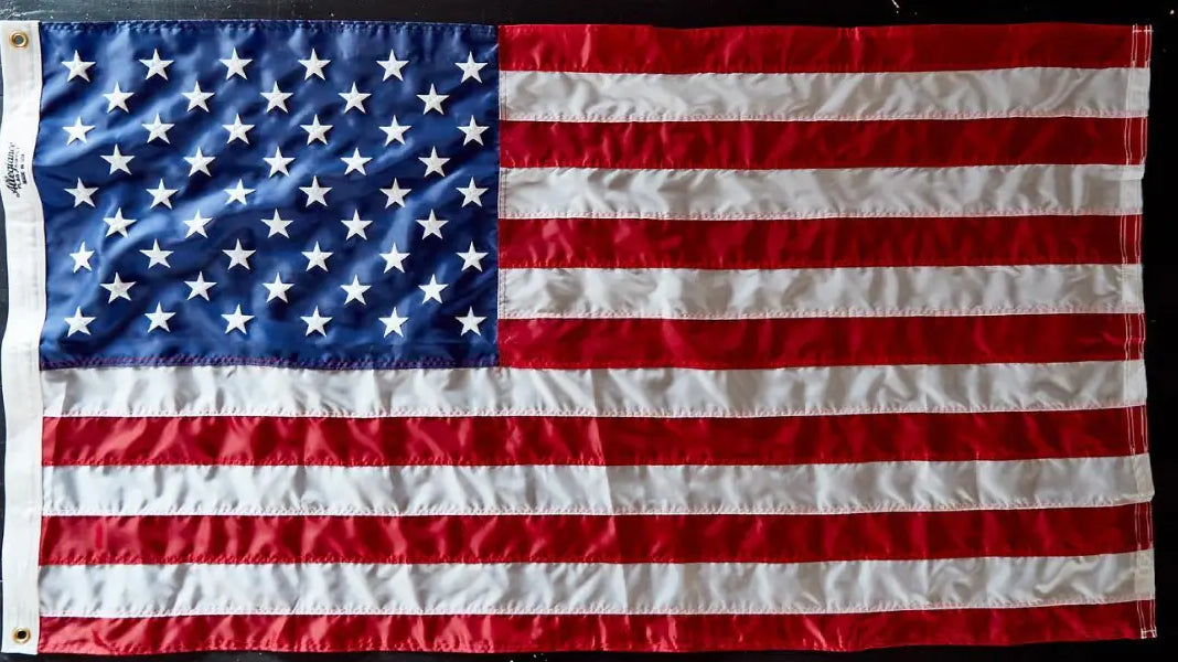 This high-quality American flag lays flat, showcasing the materials and stitching that demonstrate how American flags are made.